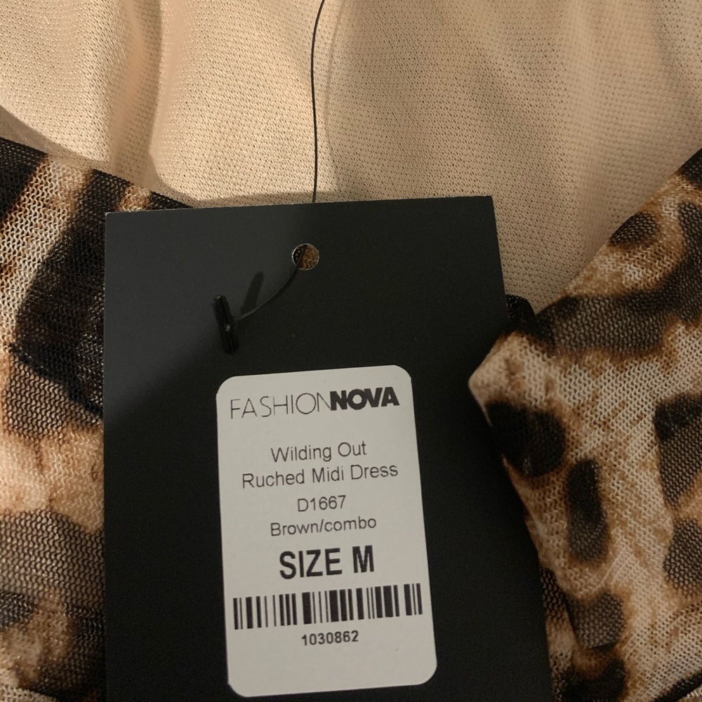 Wilding out mini Ruched dress!